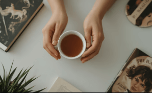 Hands holding a cup of healthy tea supporting longevity and wellness